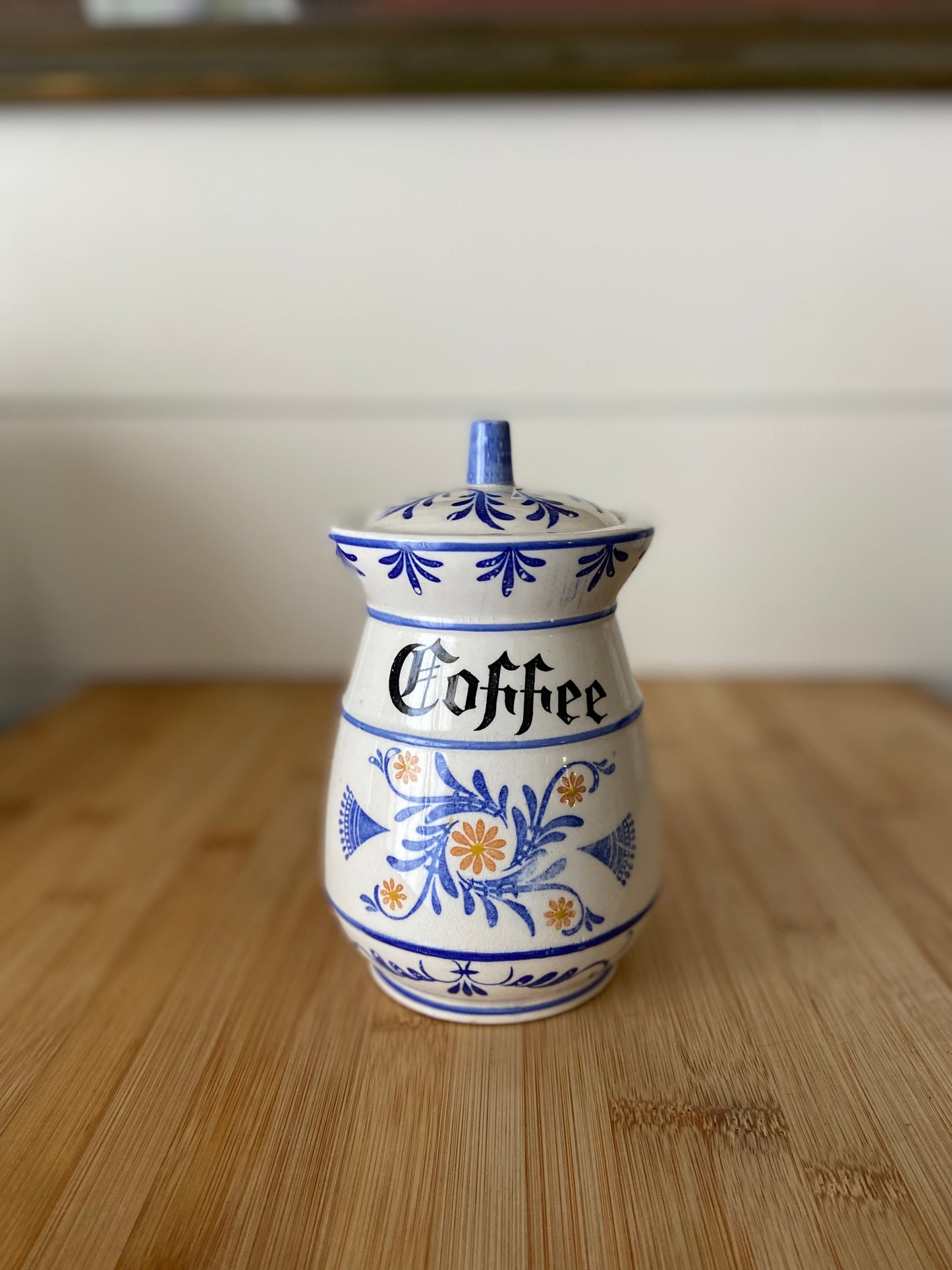 "A Royal Sealy Style coffee canister in blue and white, combining functionality with elegance."