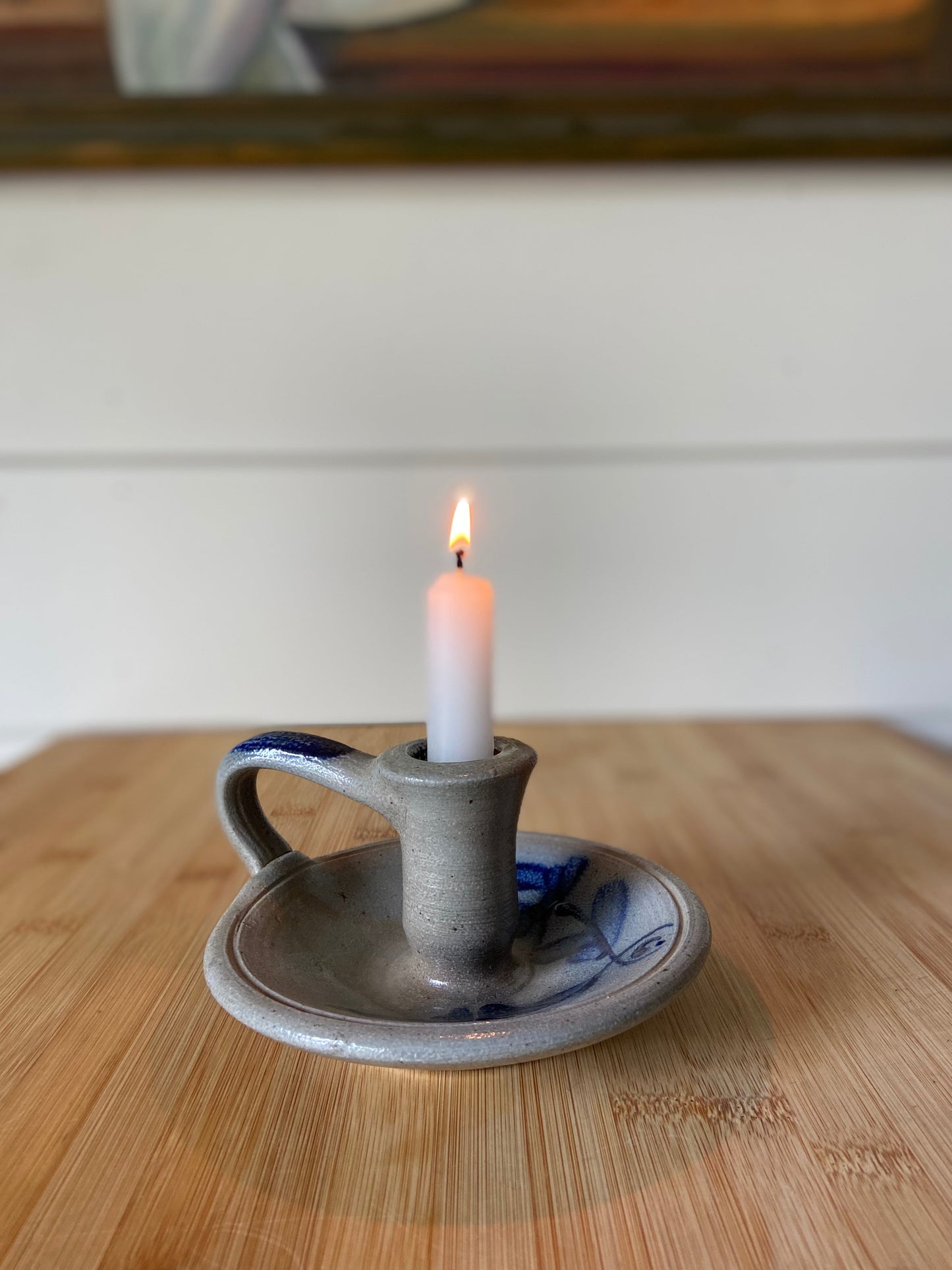 "A solid handmade Rowe Pottery candle holder with a unique design."