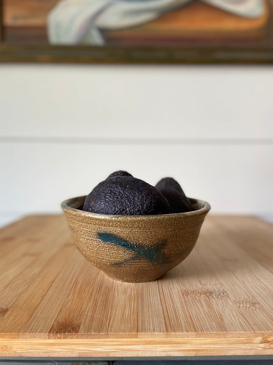 "A small handmade blue gray bowl, perfect for décor or serving berries."